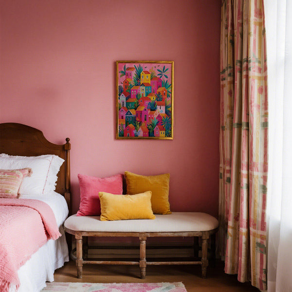 Boho decor featuring a Mexican Village Painting with pink, yellow, and teal houses.