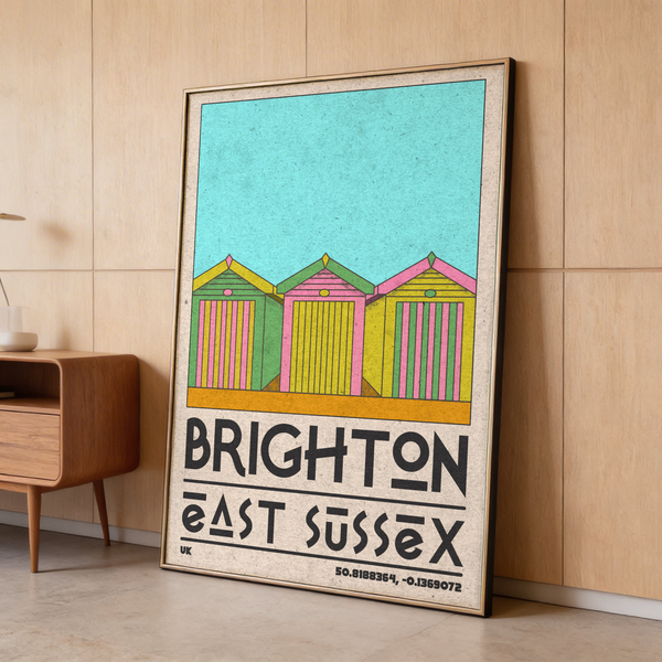 Framed Brighton Travel Print hung on living room wall