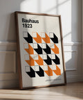 Modern black and orange artwork for office featuring abstract geometric design.