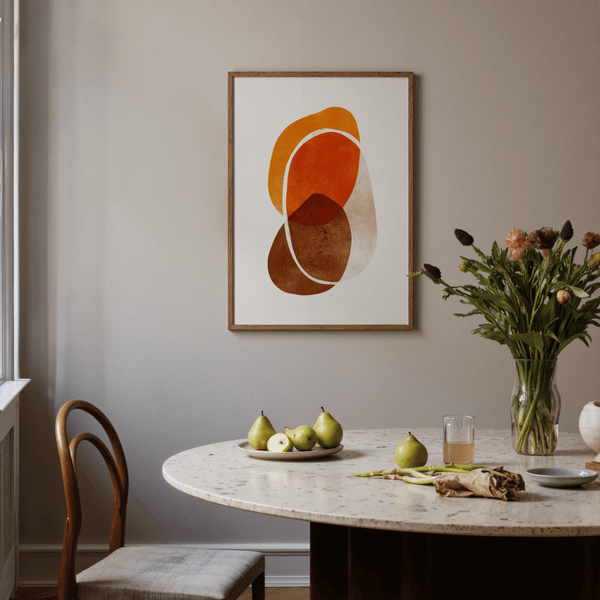 Abstract print of rounded shapes in warm oranges and cool grays