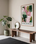 Framed high quality art prints in a bright hallway above a wooden bench.