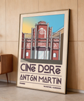 Angled perspective of travel poster print featuring Cine Doré building and decorative patterns