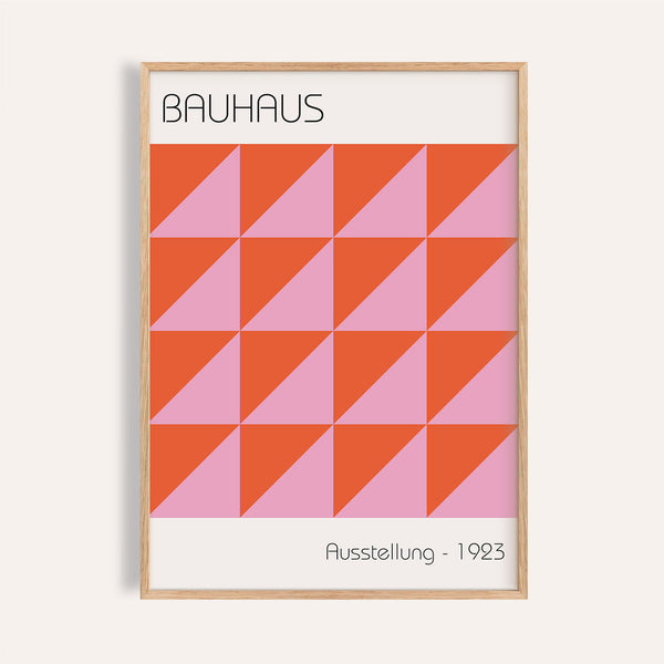 Modern wall art with pink and orange geometric triangles