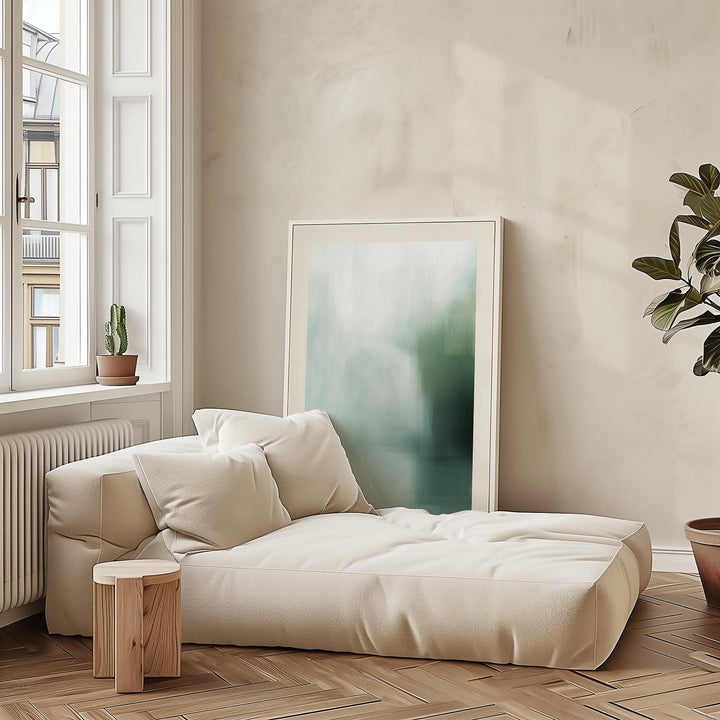 Rothko Print leaning on wall by cream sofa with a small wooden stool in a bright room