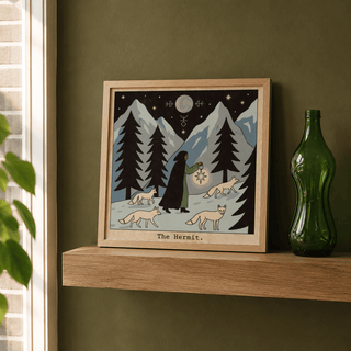 Illustrated mountains tarot poster showing moon, star symbols, and three foxes on snow