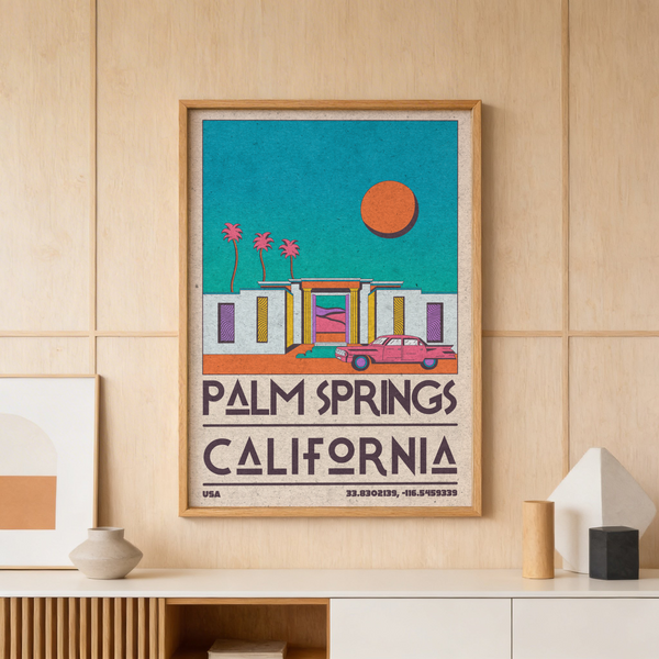 Framed view of retro Palm Springs poster showing a modern building and parked vintage car