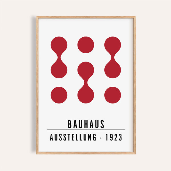 Bold red and pink artwork for office walls styled in a modern home office