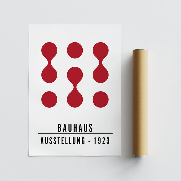 Abstract red shape artwork for office walls hung in a sleek hallway