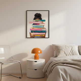 Portrait-style wall art print of a reader partially hidden behind a vertical pile of books, loose watercolor