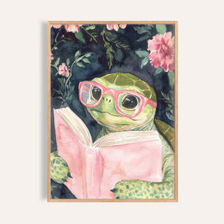 Whimsical turtle wall art print wearing glasses and reading an open book with floral accents