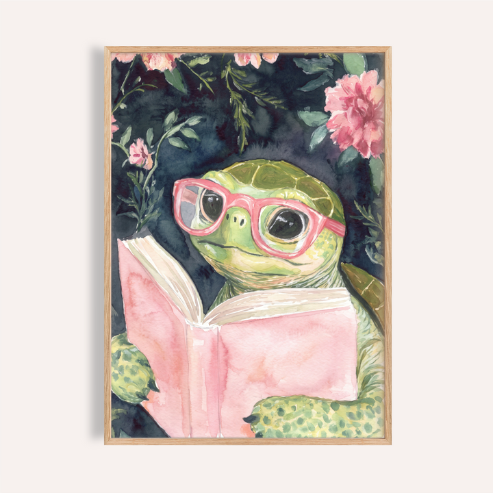 Whimsical turtle wall art print wearing glasses and reading an open book with floral accents