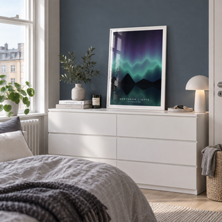 Northern lights lake reflection print on a dresser against a blue grey wall