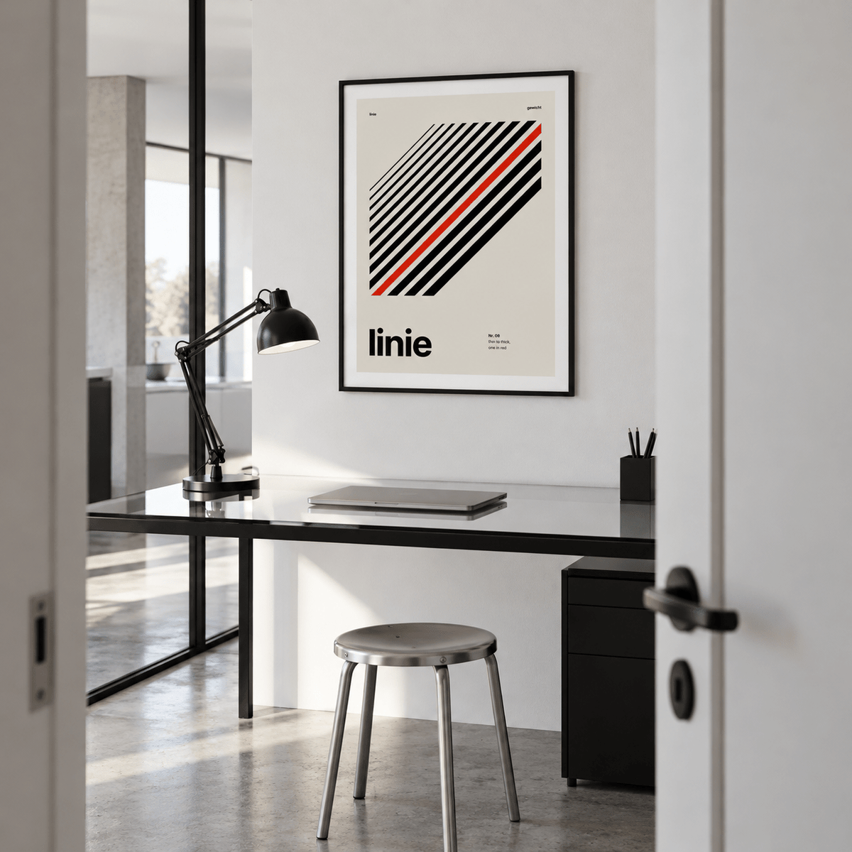 Parallel lines with one red line print in a home office against a charcoal wall