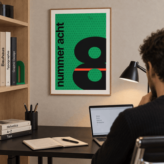 Number eight typography print in a home office against a charcoal wall