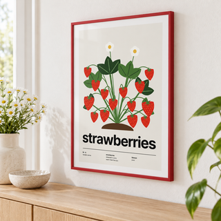 Close view of the strawberry plant heavy with red berries showing the fine print detail