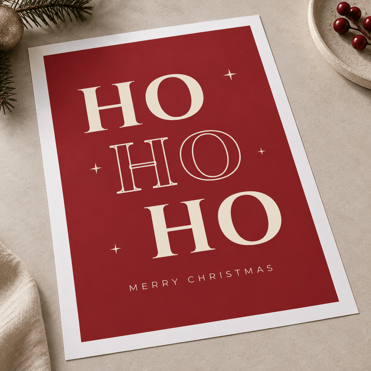 Close view of the bold red Christmas lettering print showing the paper texture and lettering