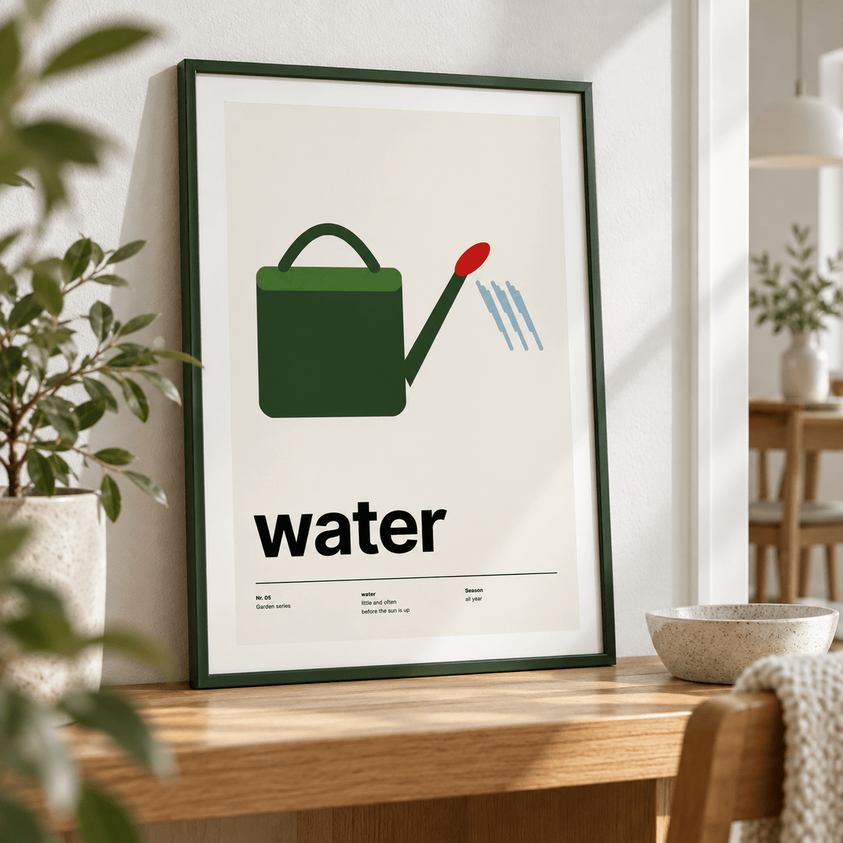 Close view of the green watering can with red rose showing the fine print detail