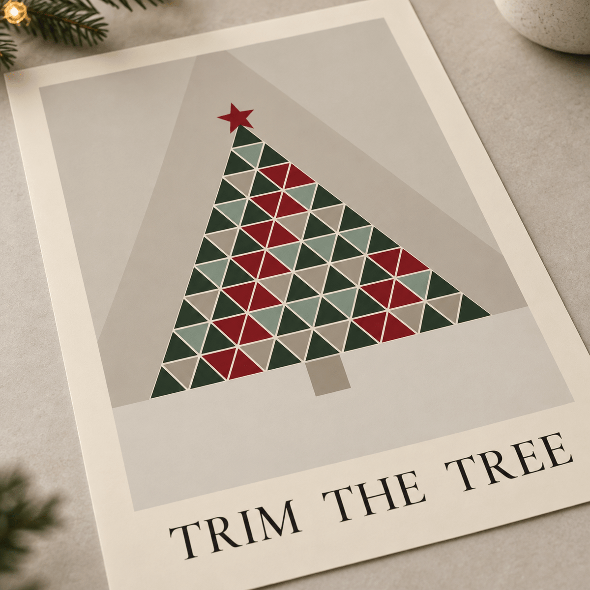 Close view of the Scandi triangle tree print showing the paper texture and lettering