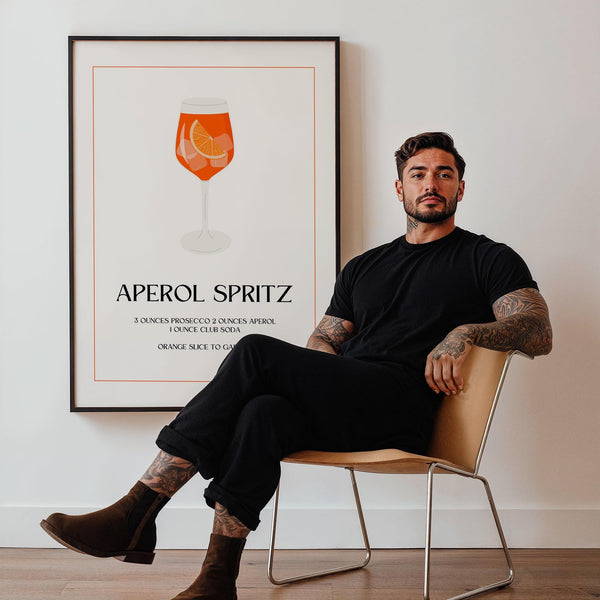 Aperol Spritz print with orange cocktail in glass and elegant serif font.