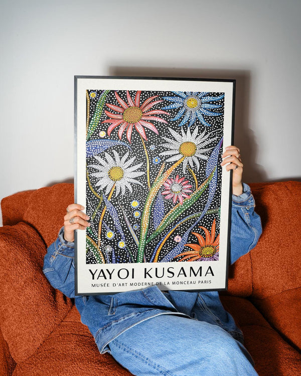 Abstract botanical wall art showing vibrant orange, pink, and blue flowers with white dots.