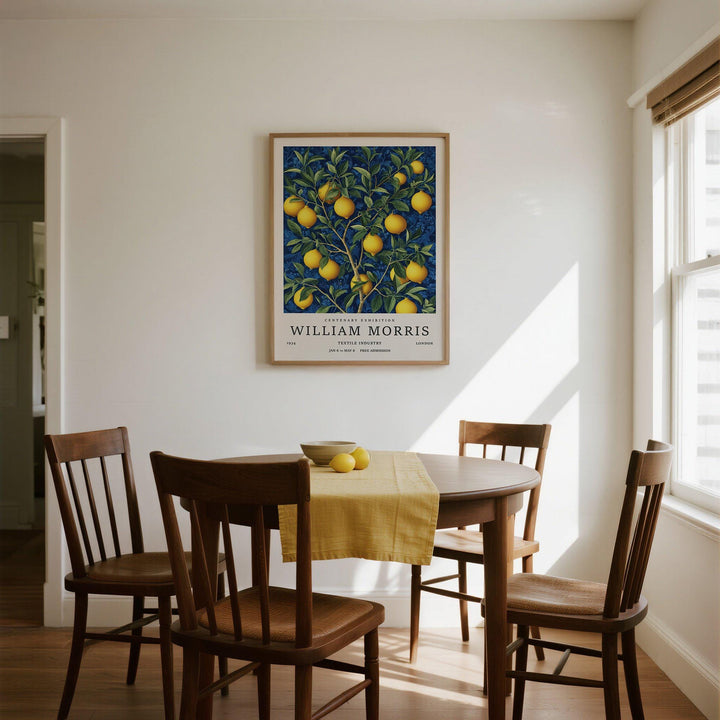 Lemon wall art illustration of a branch with yellow lemons and green leaves in a dining room above a table with a yellow runner and bowl