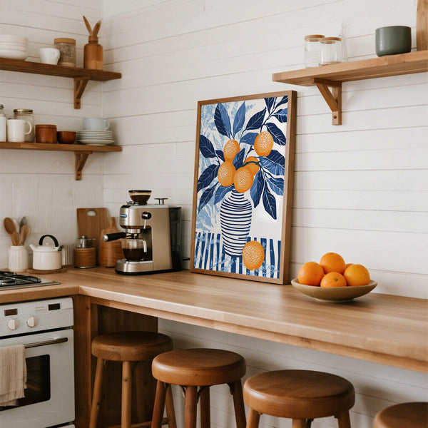 Orange blue wall art print laid flat on white table with art supplies.
