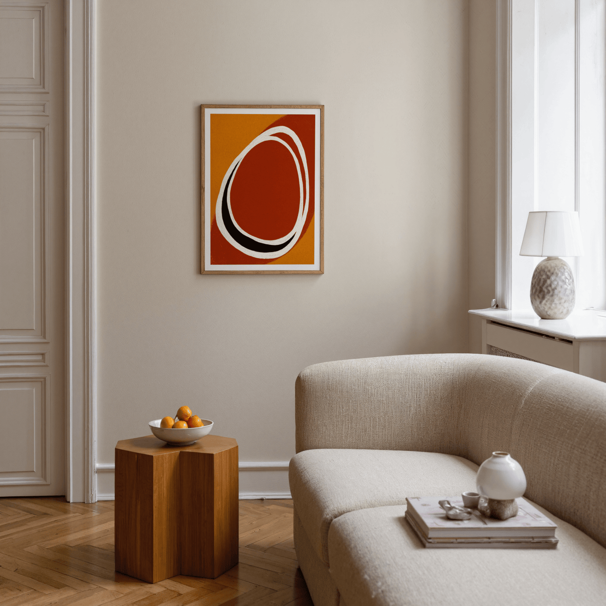 Graphic oval contour artwork in orange, red, white, and black tones