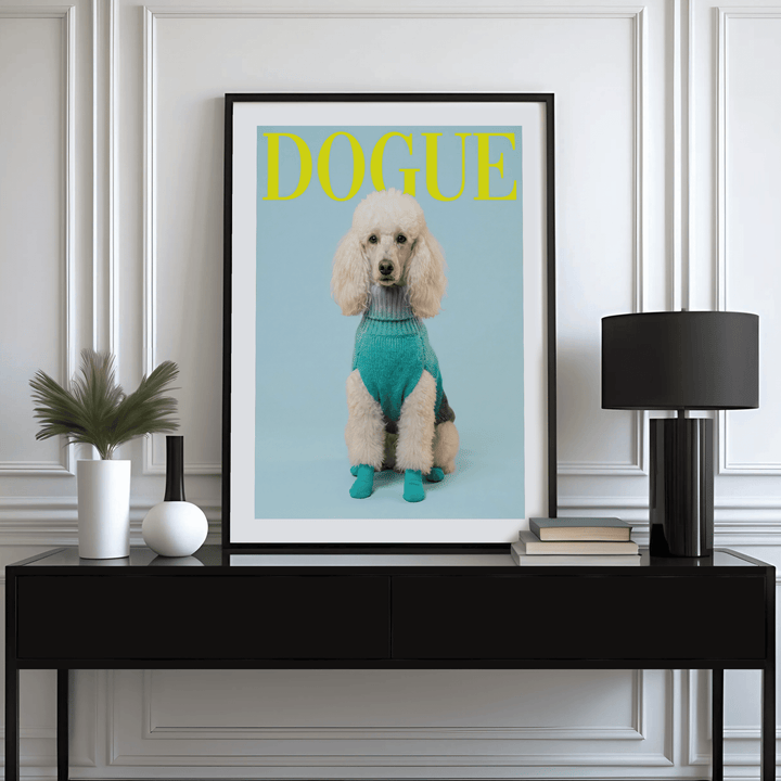 Pet Wall Decor framed print of white poodle in blue sweater on a sideboard with lamp and books