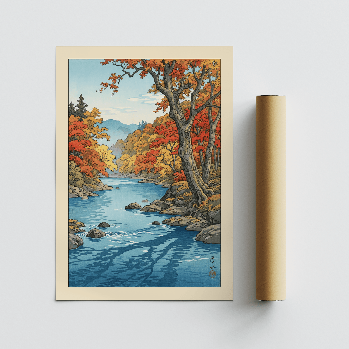 Desk-level room scene with river landscape art hung above a console