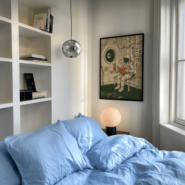 Reading Astronaut Poster featuring astronaut and book, beige, green, and orange, study decor