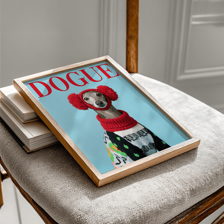 Framed Italian Greyhound wall art of a dog wearing red earmuffs and a patterned jumper on a chair