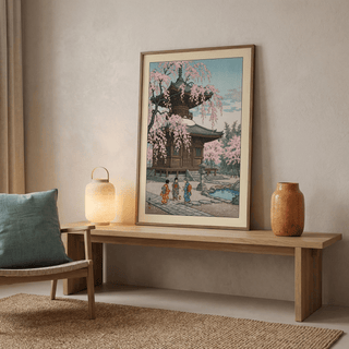 Architecture-focused wall art print showing tiered pagoda structure beneath falling cherry blossoms