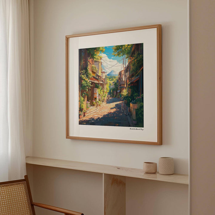 Prints Japanese Art framed print of a sunlit mountain street view in warm tones above a wooden shelf