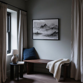 Layered peaks and a pagoda beneath a cloudy sky, black and white landscape print.