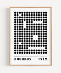 Minimalist black-and-white art print featuring a bold dot grid design
