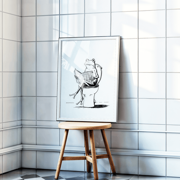 Playful illustration print of a frog on a toilet reading, drawn with crosshatching details