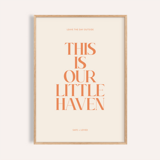 Centered quote wall art poster reading “This Is Our Little Haven” in orange serif type on beige