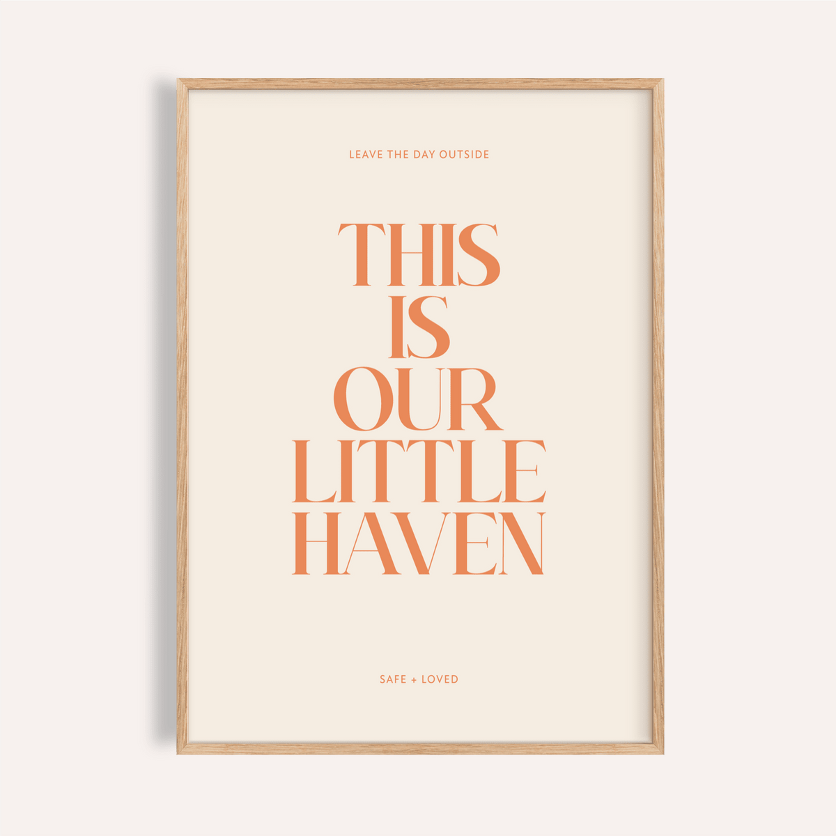 Centered quote wall art poster reading “This Is Our Little Haven” in orange serif type on beige