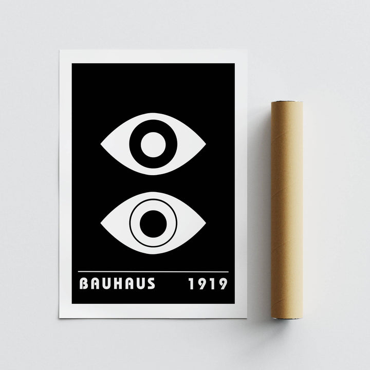 Dual Vision II print showing abstract black and white eye shapes with Bauhaus text beside a brown packaging tube