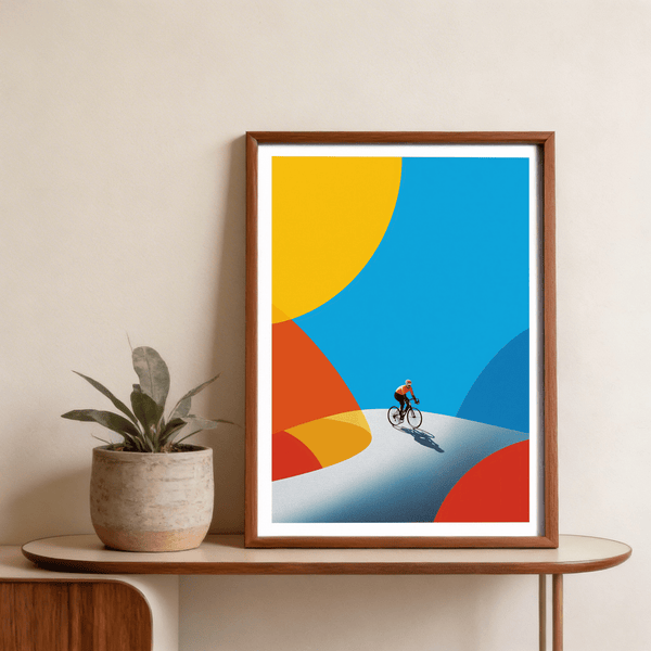Dominating the sky area, Cycling Art Print wall art shows a small cyclist below large geometric color fields