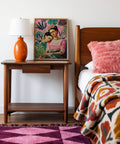 Wall Art Frida Kahlo displayed in a cozy, bohemian living room.