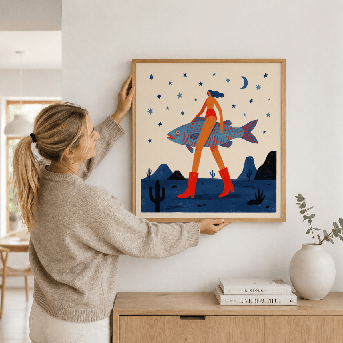 Painterly poster print of a surreal night landscape with mountains, small cacti, and a crescent moon