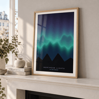 Aurora borealis over dark peaks print on a mantelpiece