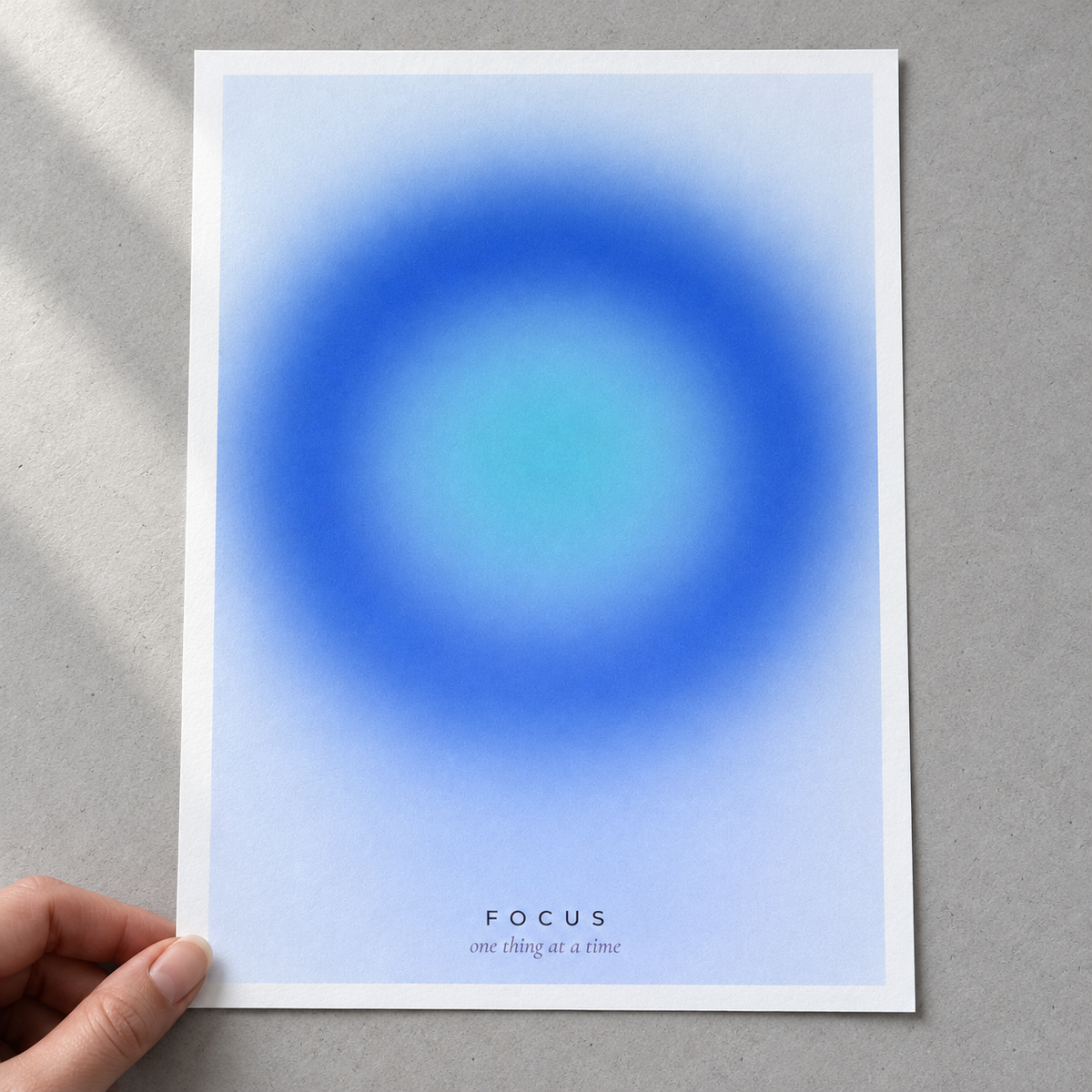 Close view of the soft blue gradient print on smooth matte paper