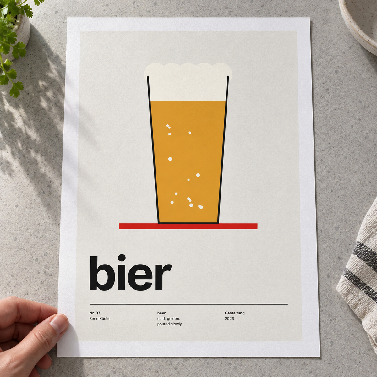 Close view of the golden beer typography print on smooth matte paper
