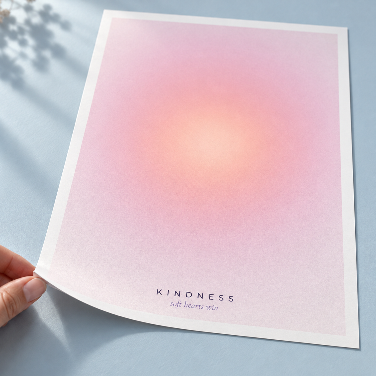 Close view of the warm pink gradient print on smooth matte paper