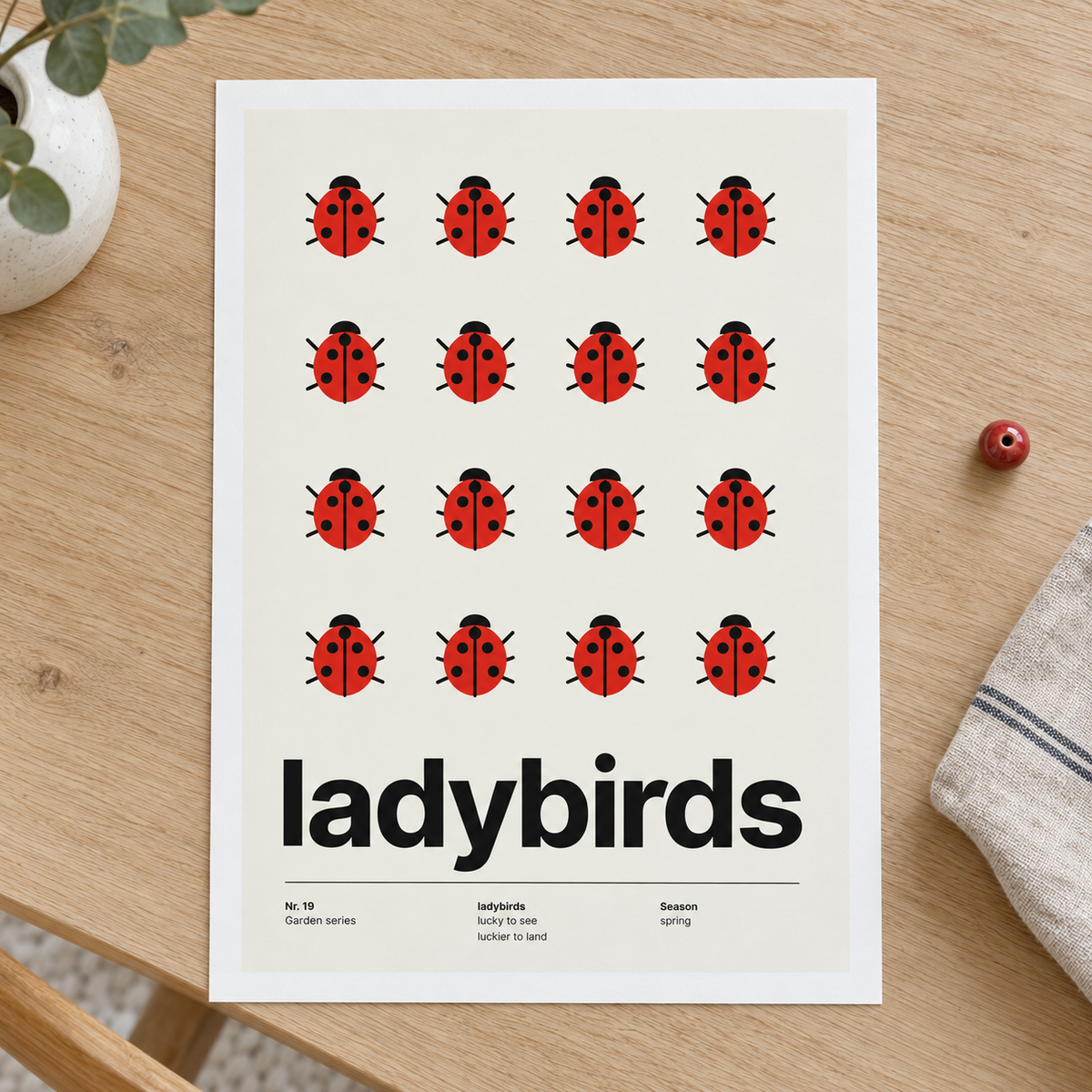 Close view of the Swiss style ladybird print on smooth matte paper