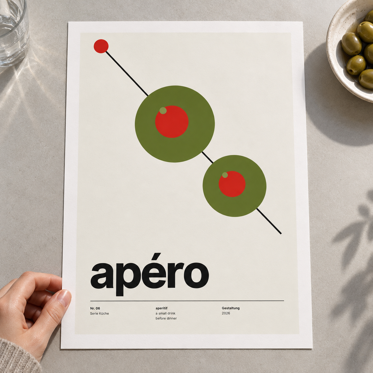Close view of the green olives with red centres print on smooth matte paper