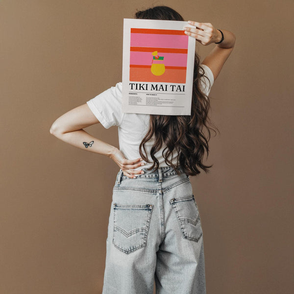 Graphic drink print featuring a yellow cocktail and tiki elements for bar decor.