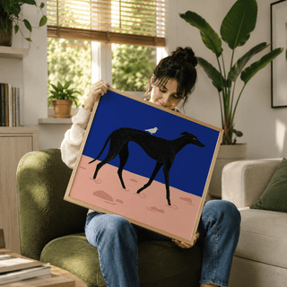 Long legged dog silhouette art print styled on desk shelf